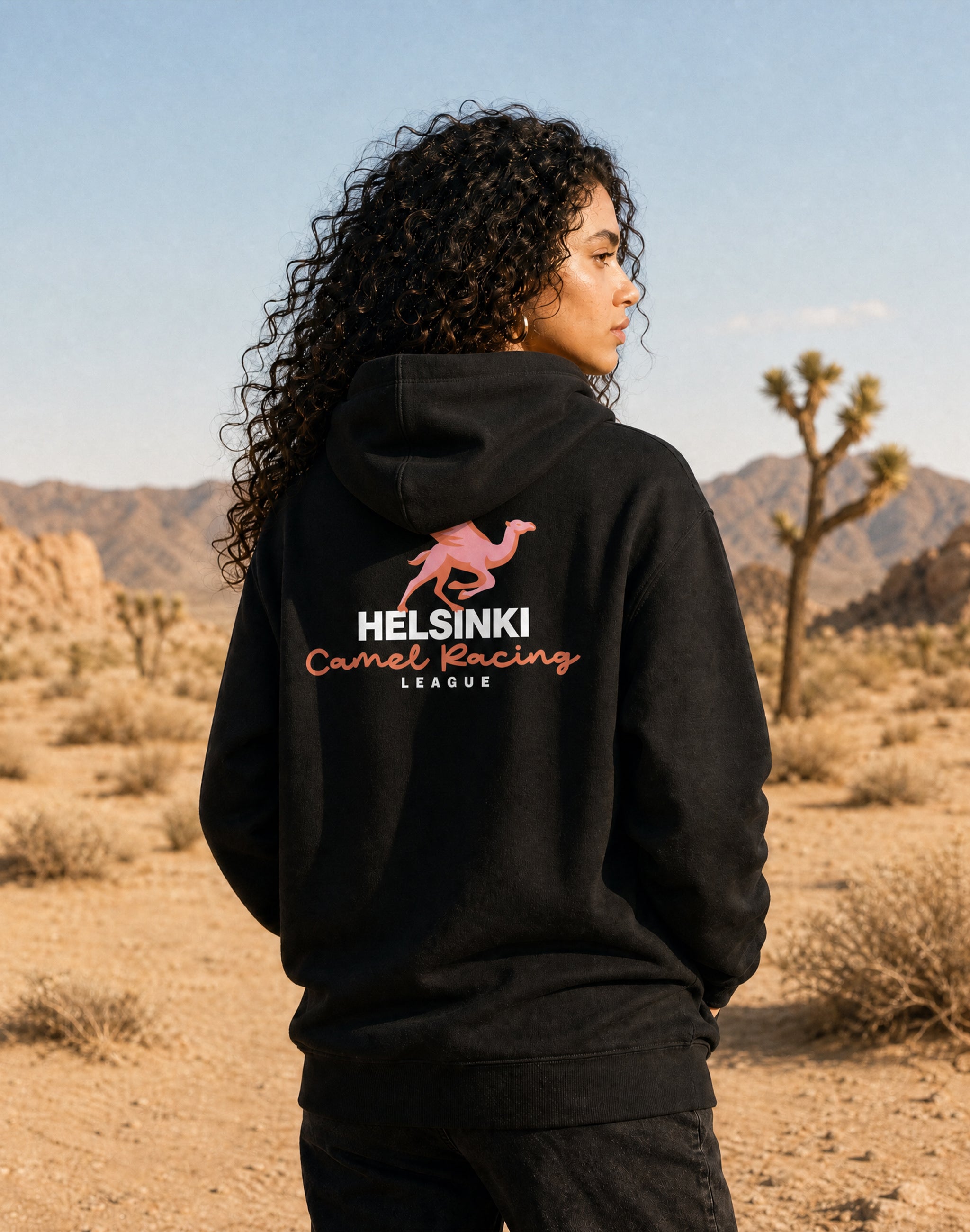 Helsinki Camel Racing League Hoodie worn by female model black back print — PERAMA Sports Federation
