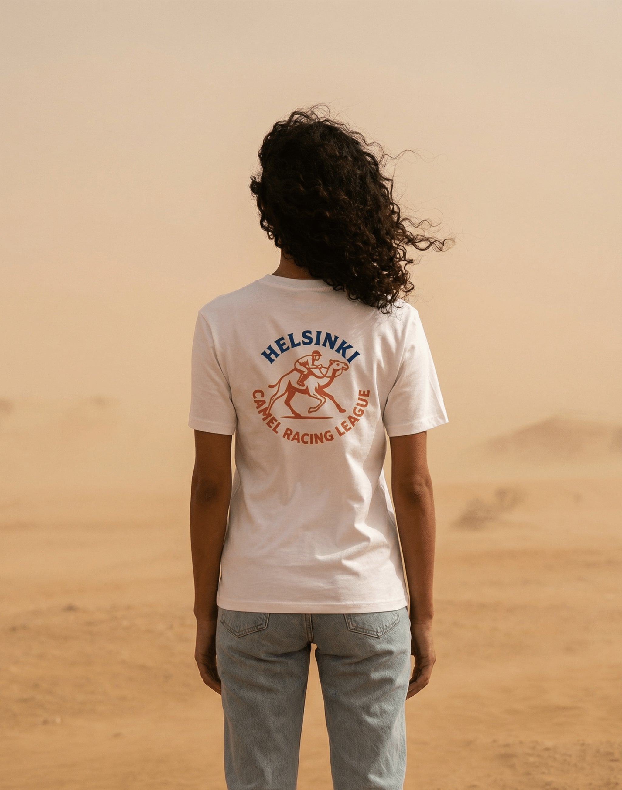 Helsinki Camel Racing League Heritage t-shirt worn in dusty desert — PERAMA Sports Federation