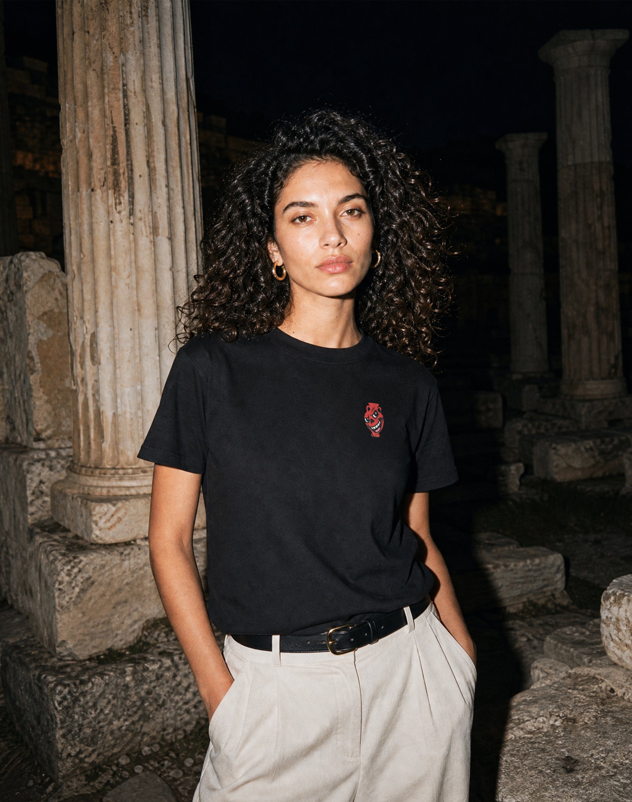 Amphora 08 T-Shirt black worn by female model flash photography greek ruins — PERAMA 