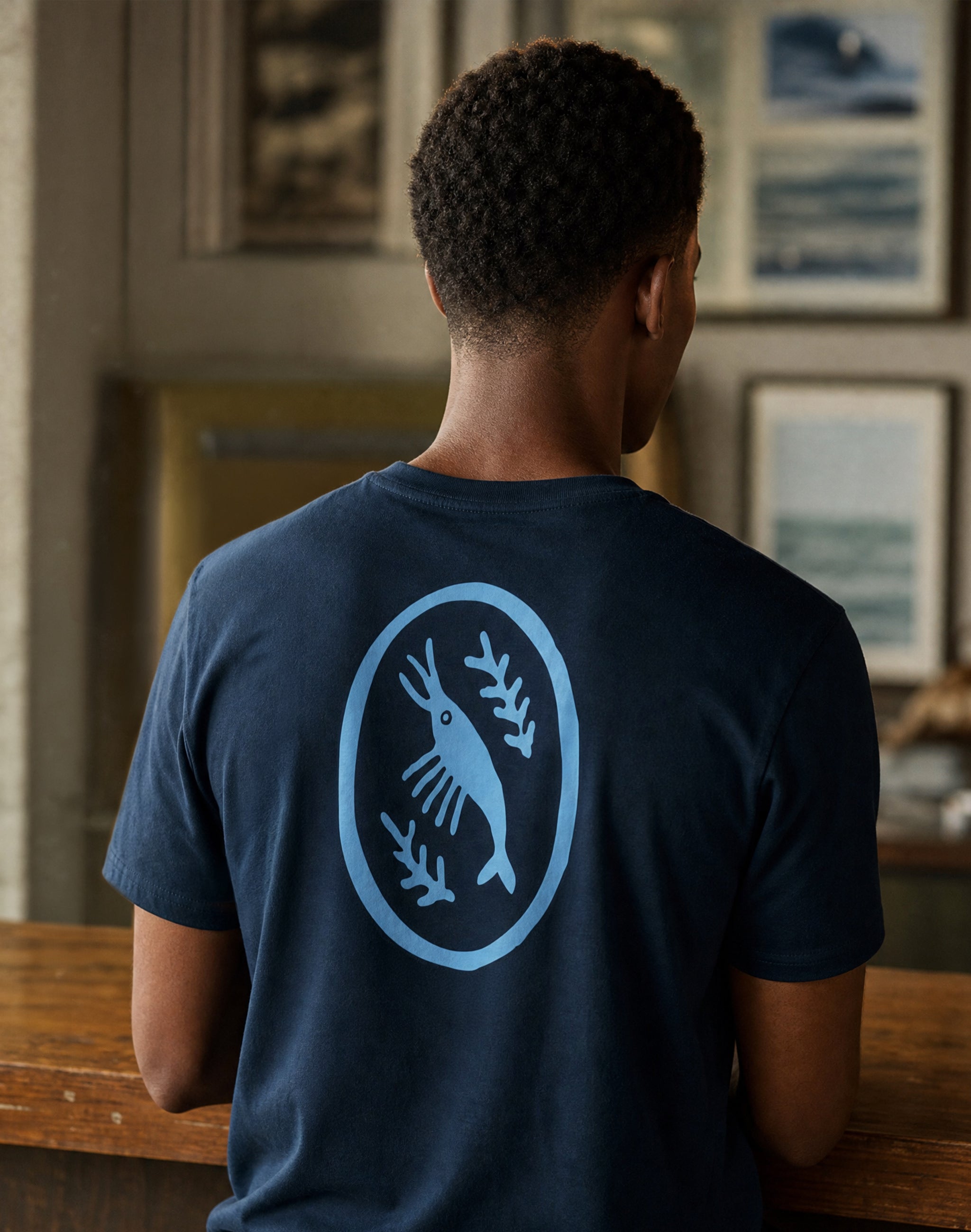 East Antarctica Cricket Club french navy t-shirt worn by male model at cricket club — PERAMA Federations