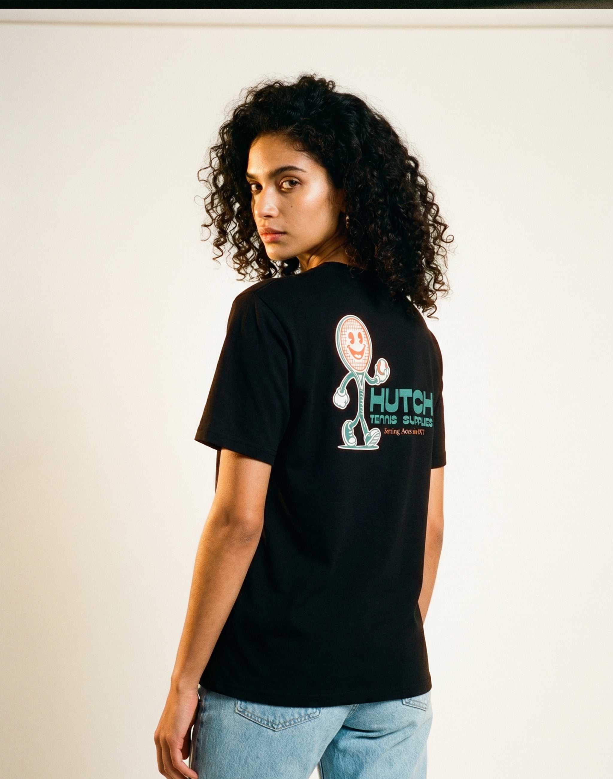 Hutch Tennis Supplies T-Shirt black back print sponsor studio soft background — PERAMA Sponsors